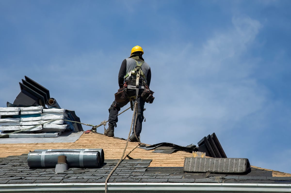 Roofing crew installing roofing materials on a Chicago home